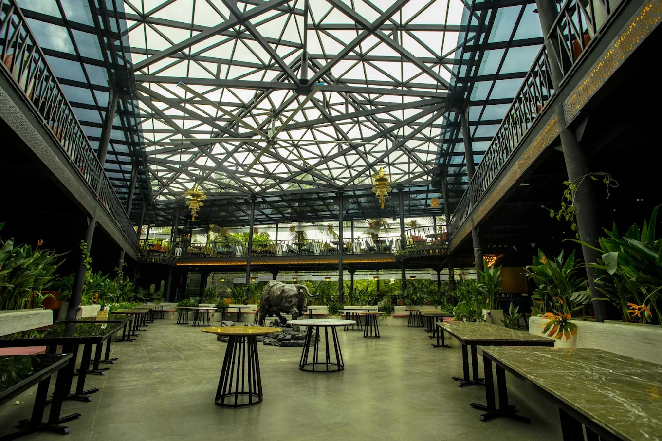 Toro atrium with geometric glass roof and bull sculpture