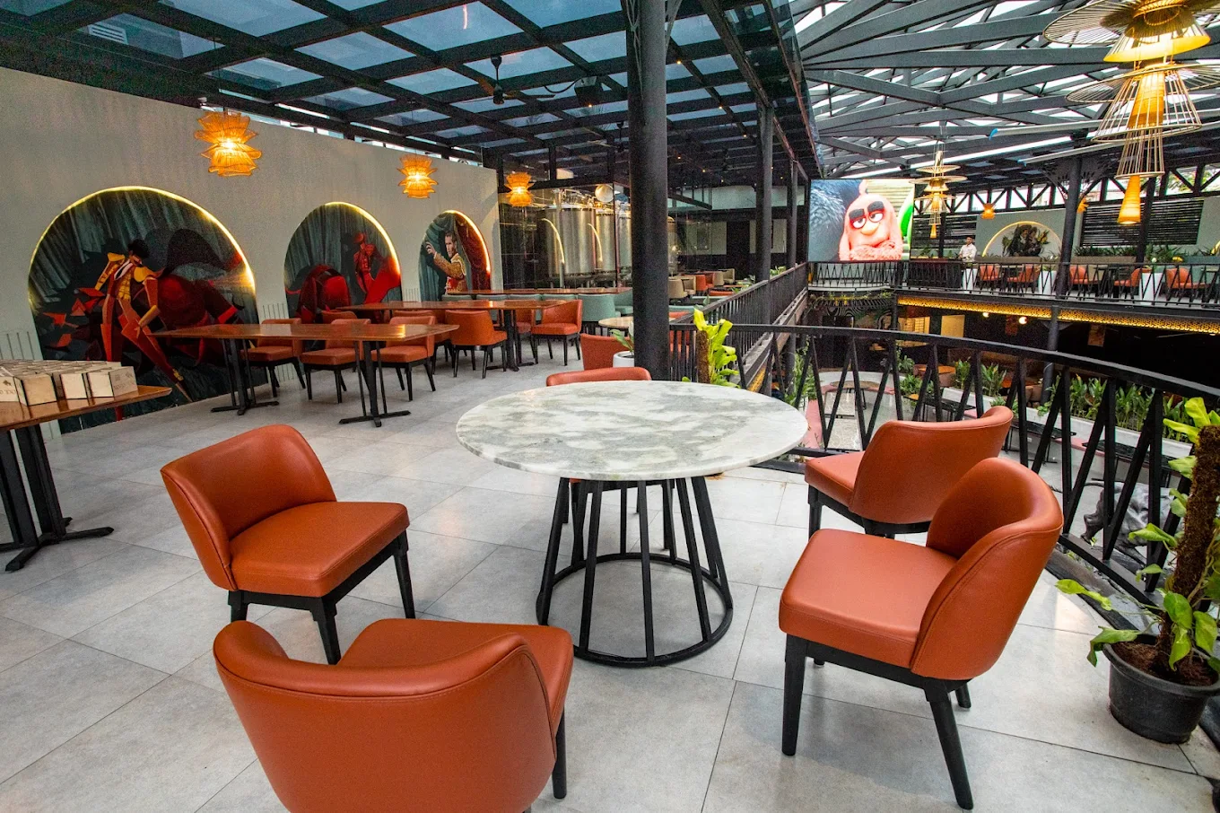Mezzanine seating with bullfighter murals